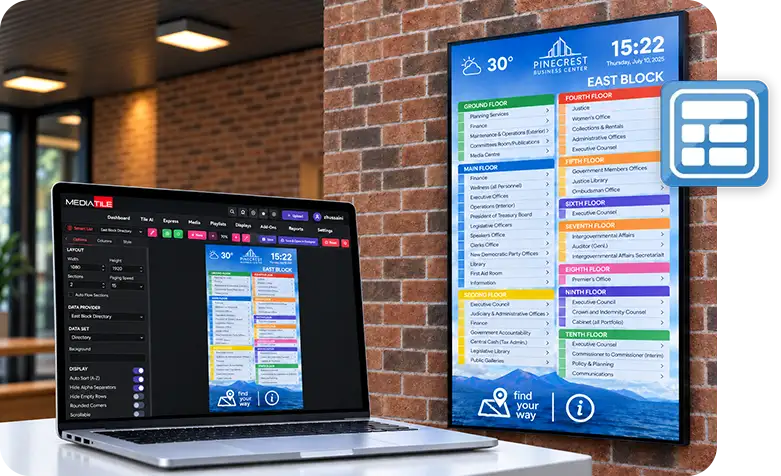 A building directory on a wall mounted screen, edited from the MediaTile dashboard on a laptop